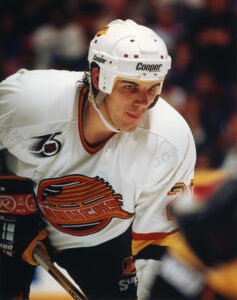 Leftwinger Gino Odjick of the New York Islanders in action during